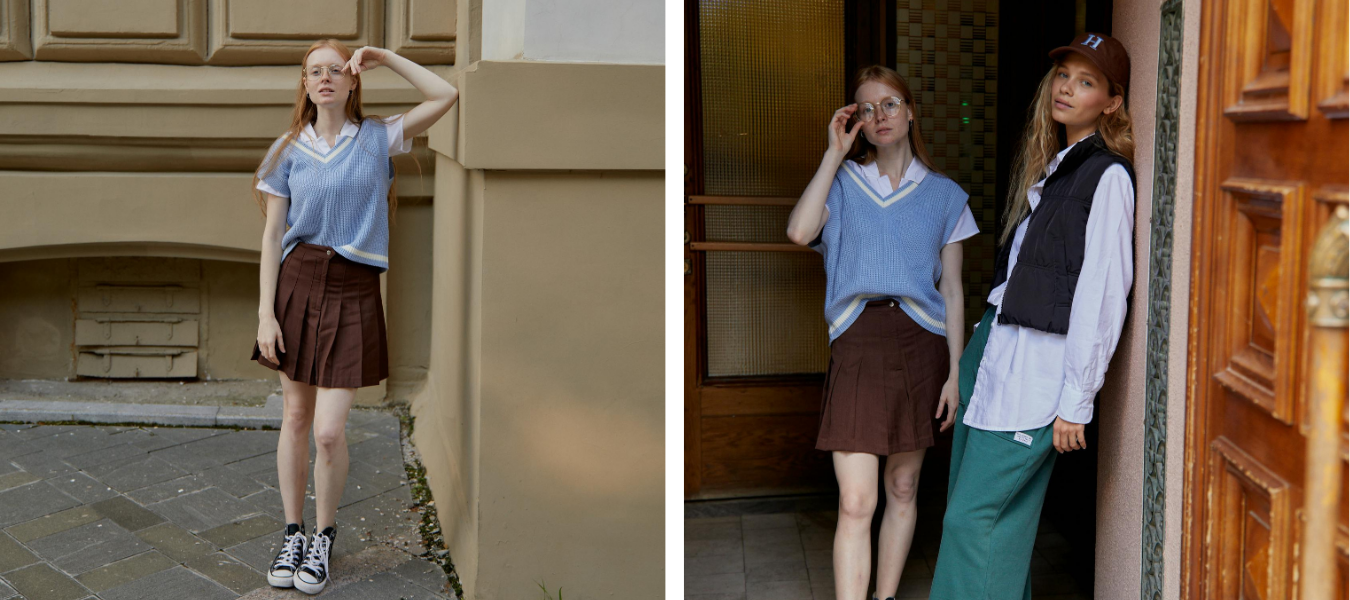 Styl preppy kobieta w białej koszuli w niebieskim sweterku