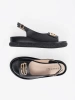 Black flat sandals with embellishment