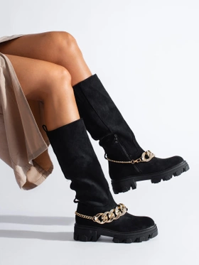 Black boots with a gold chain