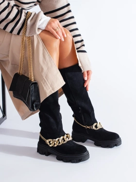 Black boots with a gold chain