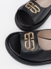 Black flat sandals with embellishment