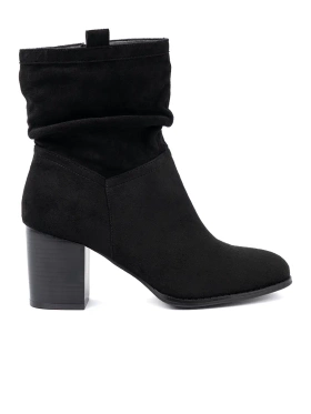 Black suede ankle boots on a column heel with ruched upper